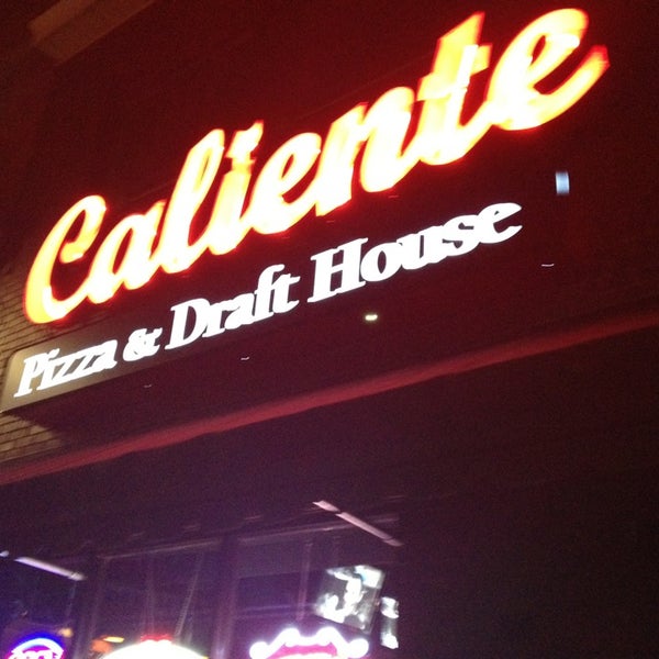 Photo taken at Caliente Pizza &amp; Drafthouse by Eric O. on 8/9/2013