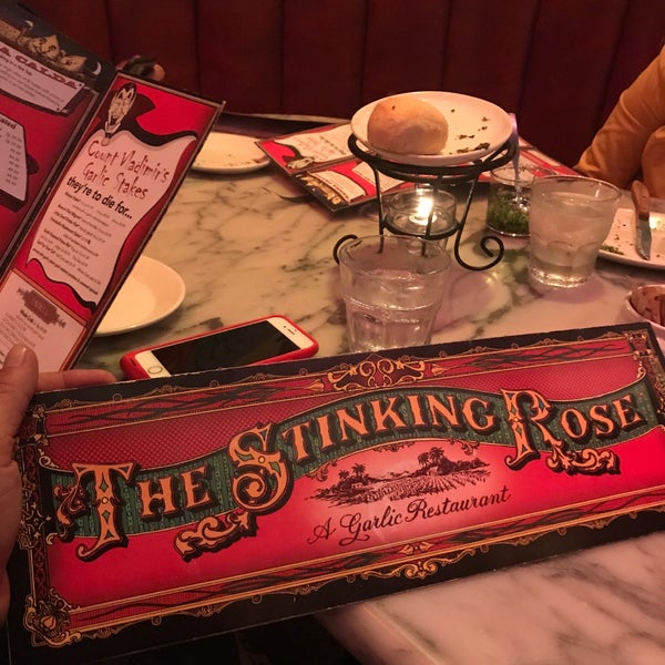 Photo taken at The Stinking Rose by Víctor S. on 3/7/2019