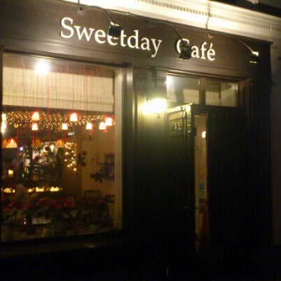 Photo taken at Sweetday Cafe by Maxim T. on 1/1/2013