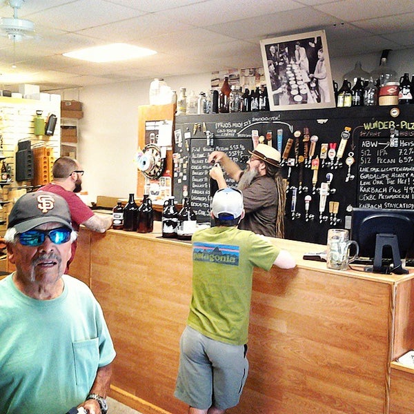 Photo taken at Growler Room by Michael F. on 5/29/2015