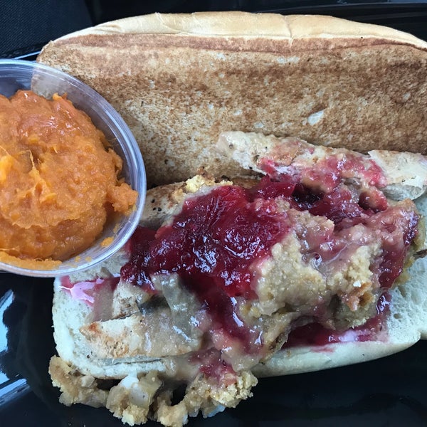 Turkey Dinner Sandwich. roasted faux turkey along with cornbread stuffing, gravy, cranberry sauce and its served on a roll.