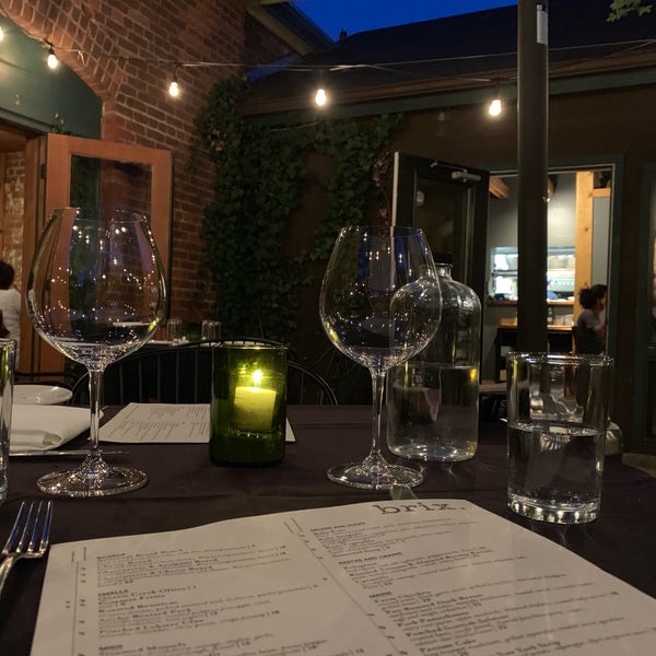 Photo taken at Brix Restaurant and Wine Bar by Edward S. on 6/10/2019
