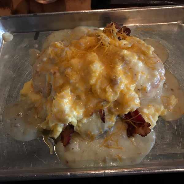 Country Benedict - scrambled eggs, bacon, sausage, biscuits, and gravy topped with cheddar. #24hourfoodgeek #sundaybrunch  Follow us at http://24hourfoodgeek.wordpress.com