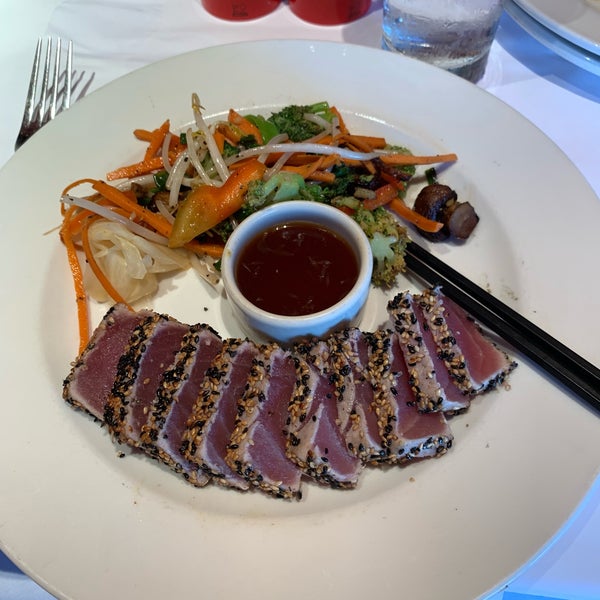 Ahi tuna steak - rare seared sesame encrusted tuna and stir fried veggies. #bricktopsrestaurant #24hourfoodgeek Follow us at http://24hourfoodgeek.wordpress.com