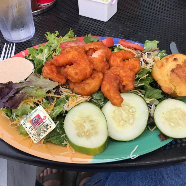 Buffalo shrimp salad - romaine, field greens, tomatoes, cucumbers, (no) red onions, cheese, shrimp coated in Franks red hot sauce and served with Cajun ranch dressing.#24hourfoodgeek.