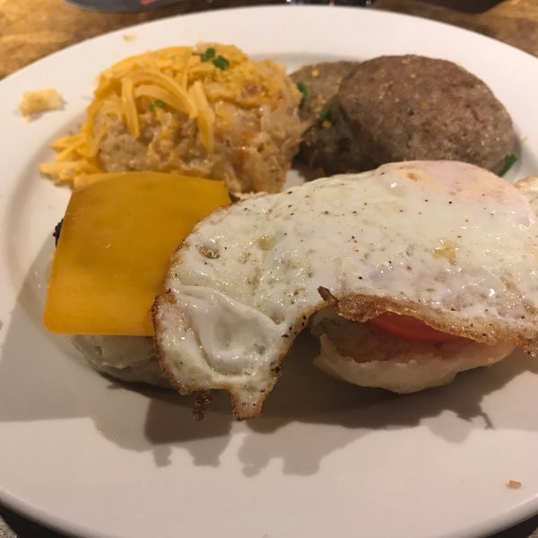 Breakfast sandwich - sausage patty, cheddar cheese, fried egg, tomato, and pepper mayo on a biscuit. #24hourfoodgeek. Follow us at http://24hourfoodgeek.wordpress.com