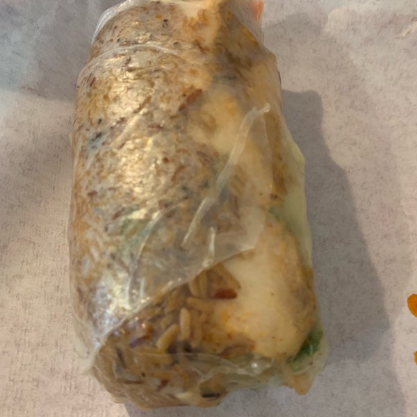 Big Thai wrap - grilled chicken, stir-fried rice, lime-ginger peanut sauce, and a rice paper wrap. #lonaslileats #24hourfoodgeek Follow us at http://24hourfoodgeek.wordpress.com