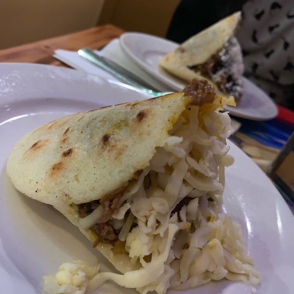 Photo taken at Arepas Cafe by Z G. on 8/24/2019