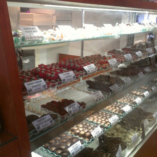 Photo taken at Li-Lac Chocolates by Chachy S. on 3/14/2013