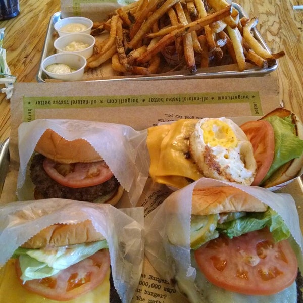 Photo taken at BurgerFi by Claudia G. on 4/12/2015