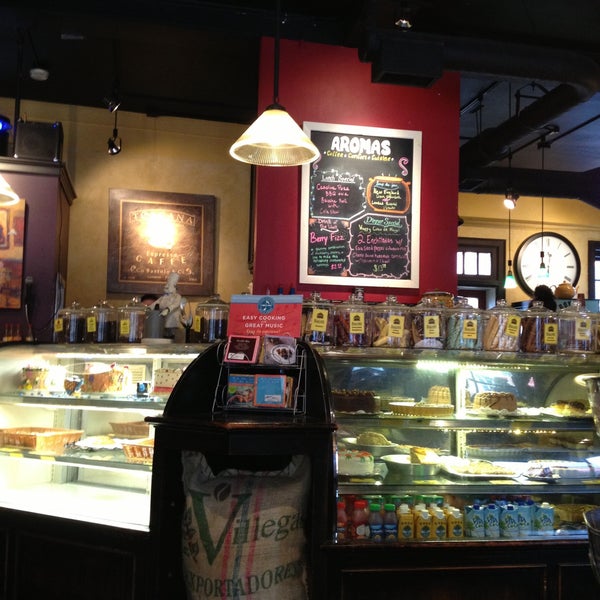 Foto diambil di Aromas Coffeehouse Bakeshop &amp; Cafe oleh Brian G. pada 5/5/2013