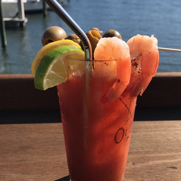 Photo taken at Outriggers Tiki Bar and Grille by Emily C. on 1/13/2019