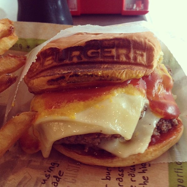 Photo taken at BurgerFi by Alex T. on 6/21/2013