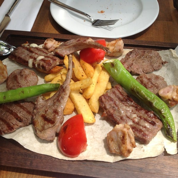 Photo taken at Flame Burger &amp; Steak House by Ertem Ç. on 6/7/2013