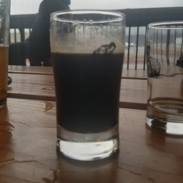 Photo taken at Hangar 24 Craft Brewery by Sudsamous S. on 12/7/2019