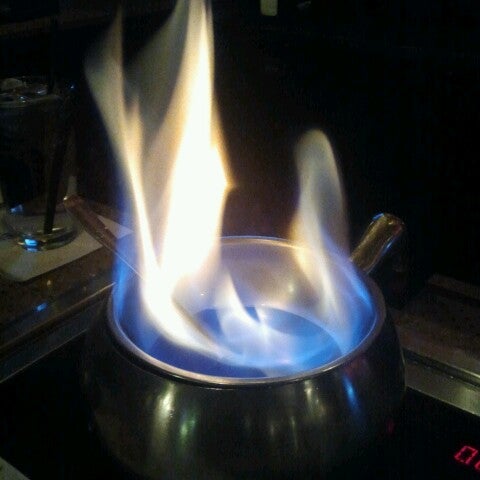 Photo taken at The Melting Pot by Heather B. on 1/2/2013