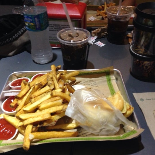 Photo taken at BurgerFi by Tom B. on 1/26/2014