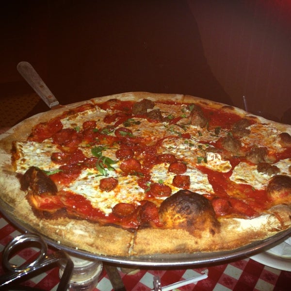 Photo taken at Lombardi&#39;s Coal Oven Pizza by Julio B. on 3/31/2013
