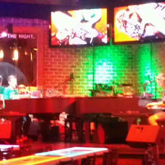 Photo taken at Bobby McKey&#39;s Dueling Piano Bar by Lisa C. on 8/21/2013