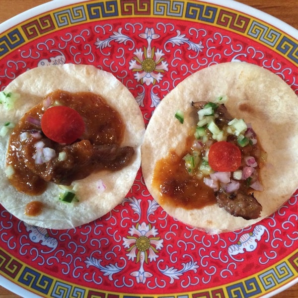 Photo taken at Foo Dog: Asian Street Food by Kathy G. on 7/17/2014