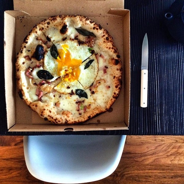 Breakfast pizza ($14) involves runny fried eggs & sweet-salty pancetta that clings to pieces of melted fior di latte mozzarella. It's everything good about the bacon-and-egg combo on a charred crust.
