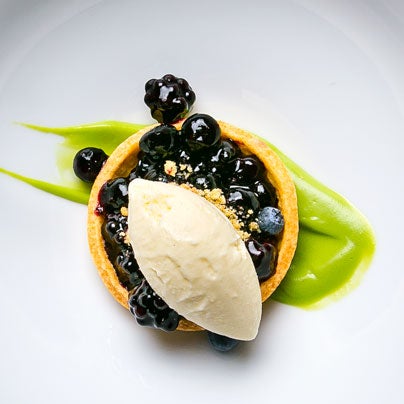 Try the new blackberry-blueberry tart with corn ice cream and basil reduction. Created by élan's pastry chef Diana Valenzuela.