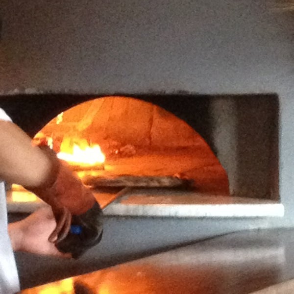 Photo taken at Dough Artisan Pizzeria by Michael G. on 5/25/2013