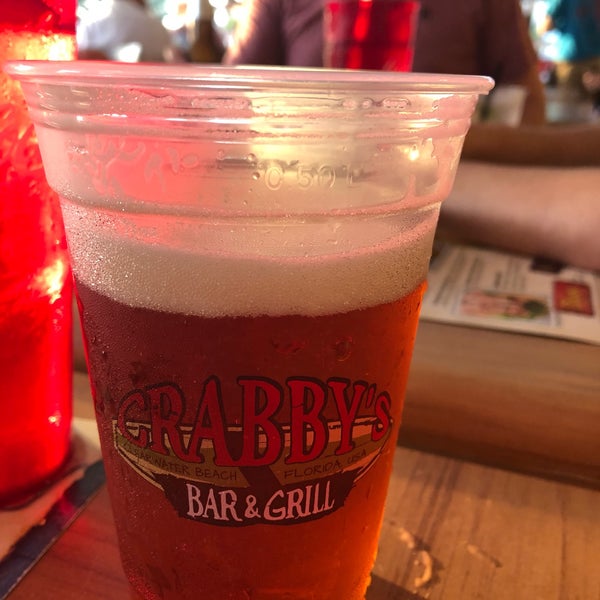Photo taken at Crabby Bar &amp; Grill by Megan M. on 6/22/2019
