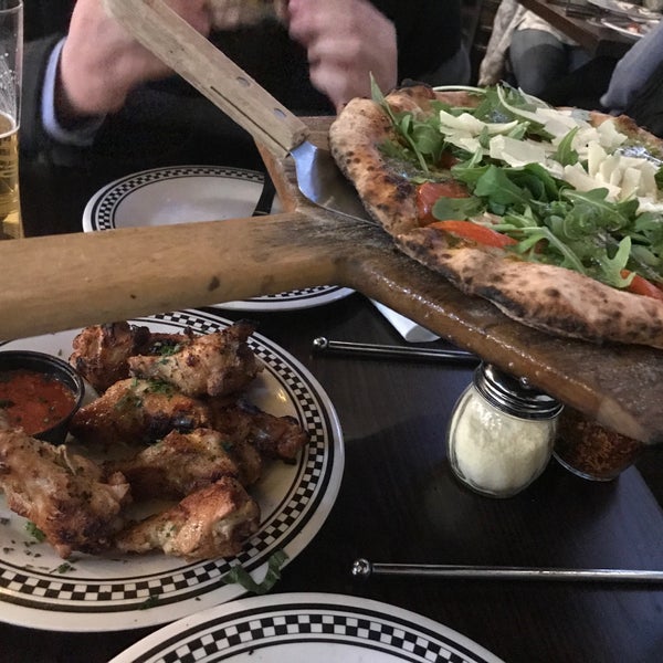 Photo taken at Rocco&#39;s Wood Fired Pizza by Marie F. on 3/21/2019