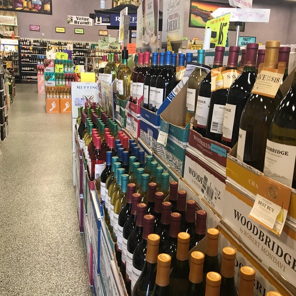 Photo taken at Wild Horse Wine &amp; Spirits by Marie F. on 7/26/2018