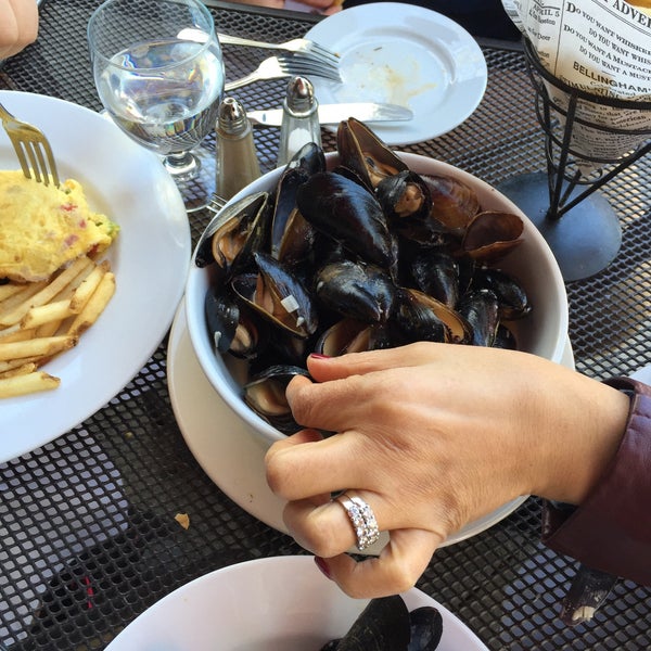 get the mussels with white clam sauce with fries. dip fries and bread into the broth after youve devoured the mussels.