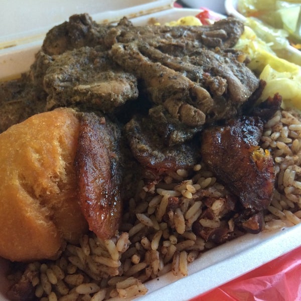 Photo taken at Ackee Bamboo Jamaican Cuisine by Jennifer S. on 6/12/2014