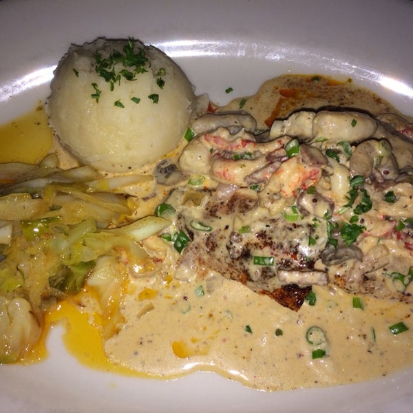 Delicious!!! Salmon Ponchartrain -blackened, topped with shrimp, crab and crawfish in mushroom brandy cream