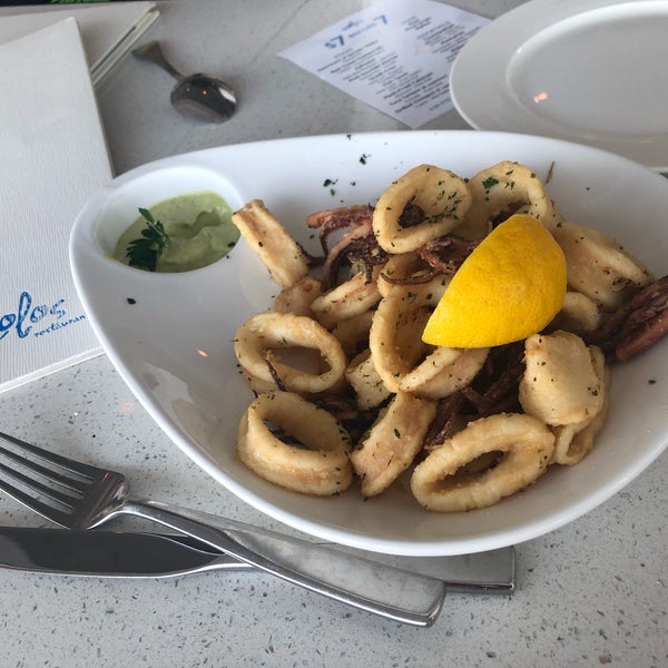 Foto diambil di Molos Restaurant oleh Trace S. pada 5/7/2019