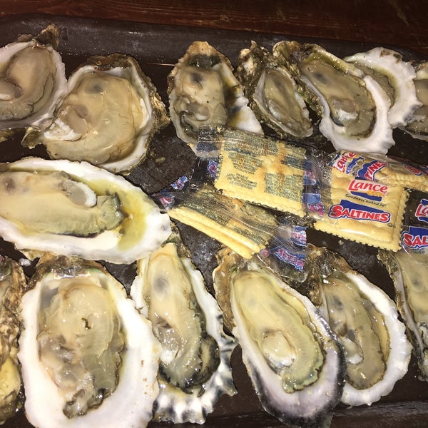 Photo taken at Shuckums Oyster Pub &amp; Grill by Keith J. on 3/16/2019