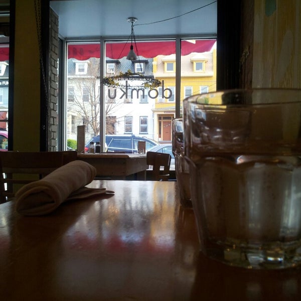 Photo taken at Domku Bar &amp; Cafe by James M. on 4/10/2013