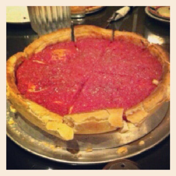 Photo taken at Giordano&#39;s by Eric K. Noji, M.D. on 10/31/2012