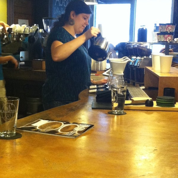 Photo taken at Alabaster Coffee Roaster &amp; Tea Co. by Taylor D. on 6/13/2014