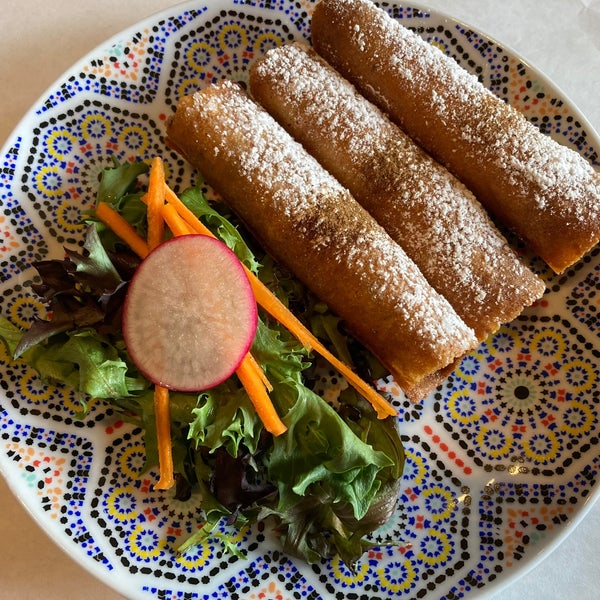 Moroccan Cigars (baked layers of thin pastry stuffed with minced beef and eggs, fried then sprinkled with cinnamon and powdered sugar)