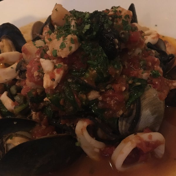 FRUTTI DI MARE (House made squid ink spaghetti, seasonal fresh seafood, spicy marinara, capers, cured olives, baby spinach)
