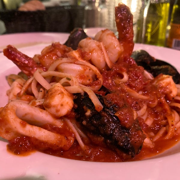 Seafood Diavola (Shrimp, mussels, scallops, and calamari, sauteed in a spicy red sauce served over linguini)