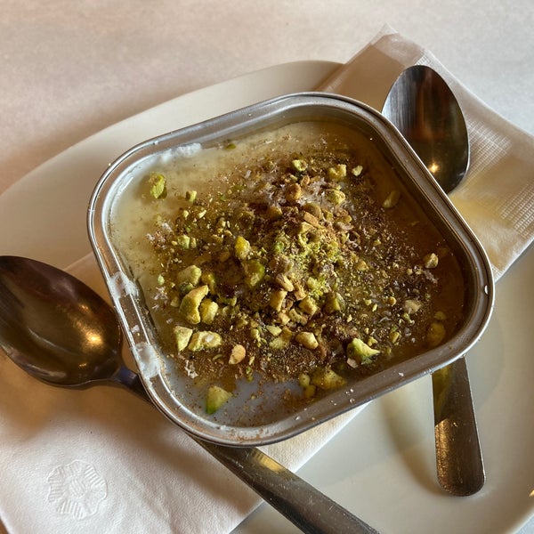 Lebanon Night (cold white custard with a hint of rose water, topped with pistachio nuts and cinnamon, sprinkled with coconut)