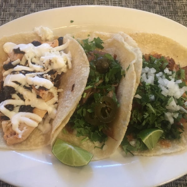 Three kinds of taco: pollo con mole, carnitas, barbacoa