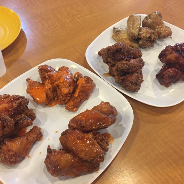 Wings with an assortment of sauces: BEAST MODE, HOT MAMA! THAI CHILI LIME, O'S ORIGINAL, HONEY MUSTARD, BEE-BEE-Q