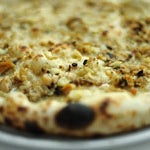 The "nucci" is a prettily charred-and-blistered combination of Emmental cheese with olives, arugula, capicola and herbs.