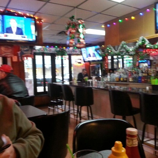 Photo taken at Snickers Bar &amp; Grill by MaryEllen R. on 12/26/2012