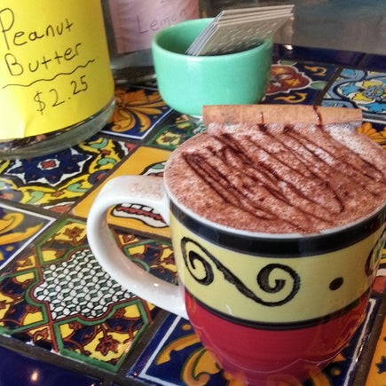 Chocolate imported from Mexico is hand-ground daily, then spiced up with cayenne, cinnamon and nutmeg, blended with steamed milk and garnished w/ chocolate and a cinnamon stick.