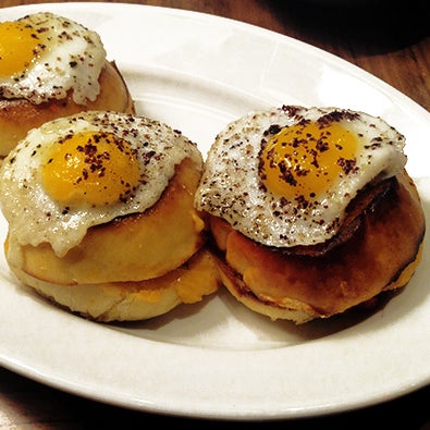 Order the happy hour snack of pimento cheese sandwiches topped with delicate fried yolks held tight by crispy whites.