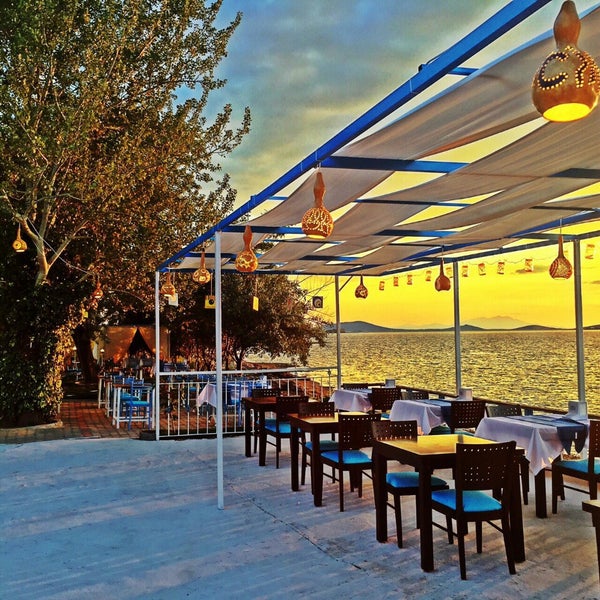 Photo taken at Delicia Restaurant &amp; Beach by Yigit D. on 6/6/2015