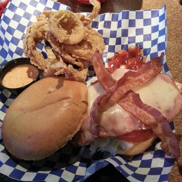 Photo taken at Blue Moose Burgers &amp; Wings by Greg D. on 5/25/2013